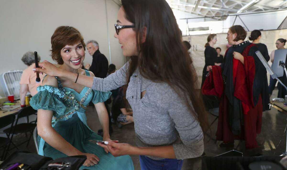 Makeup artist Anna Rodriguez helps Kendra Broom prepare for her title role in “Pélleas & Mélisande,” at West Edge Opera.