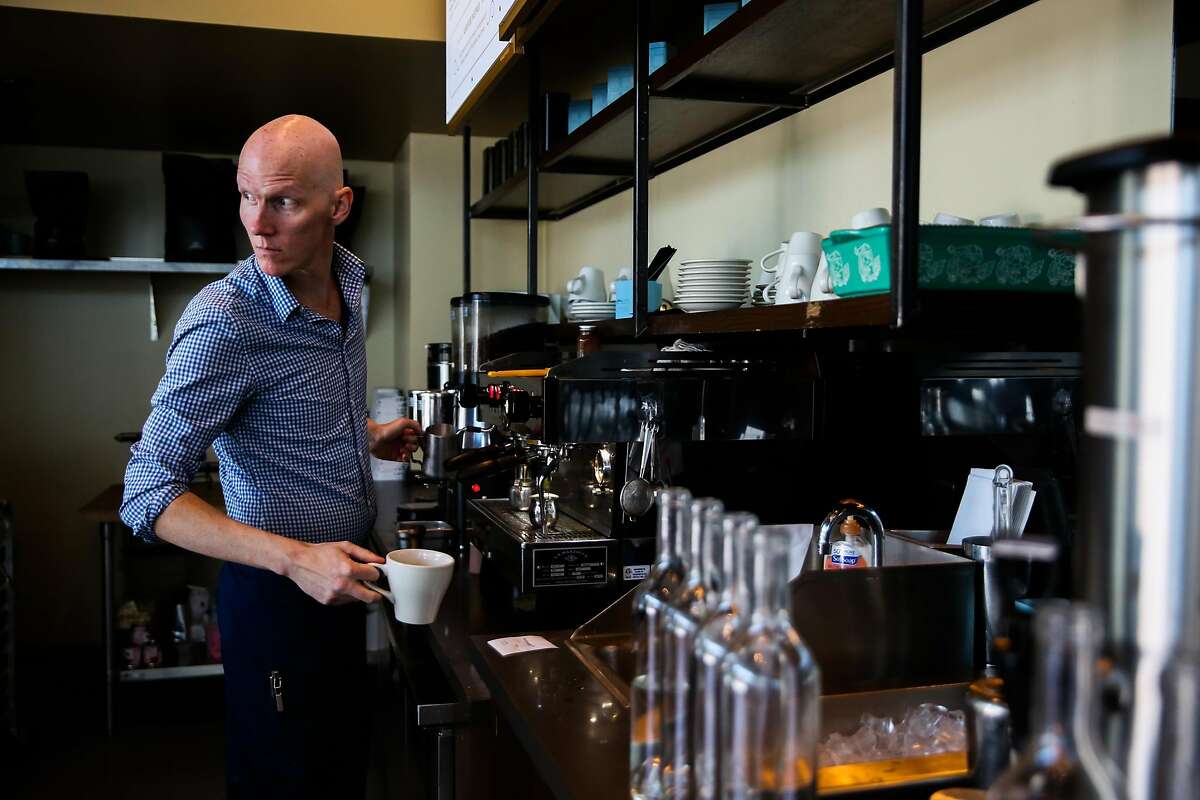 Barista Andrew Worley makes a coffee for a lunch patron at Corridor restaurant in San Francisco, California, on Tuesday, July 24, 2018.