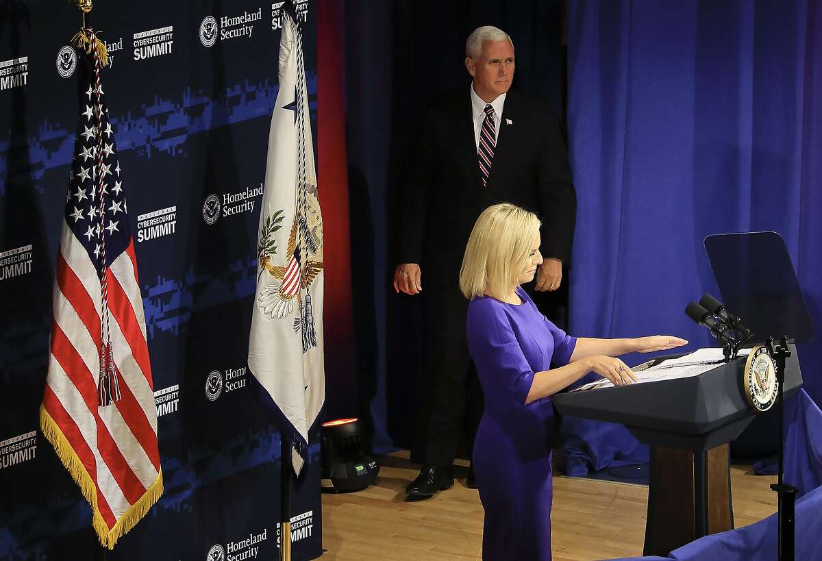 Department of Homeland Security (DHS) Secretary Kirstjen Nielsen introduces Vice President Mike Pence to address the DHS National Cybersecurity Summit, Tuesday July 31, 2018, in New York. (AP Photo/Bebeto Matthews)