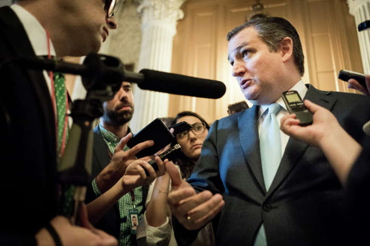 Sen. Ted Cruz talks to reporters in June on Capitol Hill in Washington. Cruz continues to hold a slim margin over challenger Beto O'Rourke.