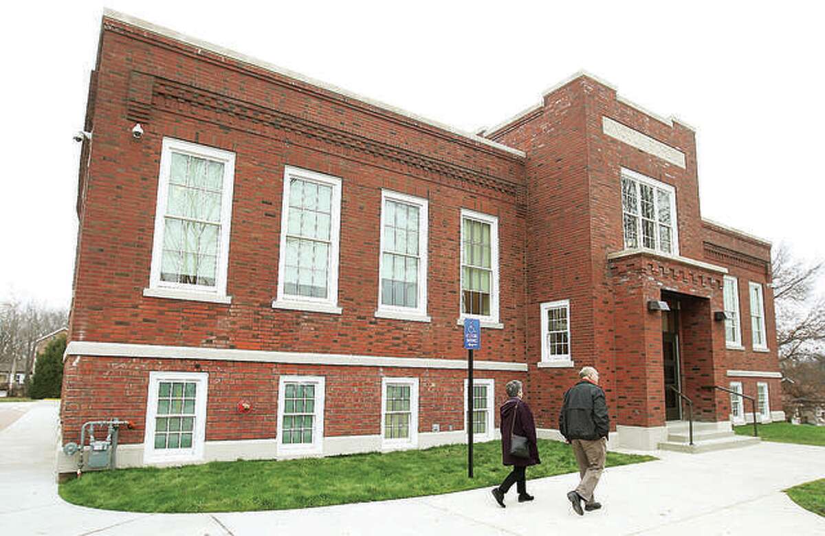 Visitors enter the Mannie Jackson Center for the Humanities at the historic former Lincoln School on Main Street.
