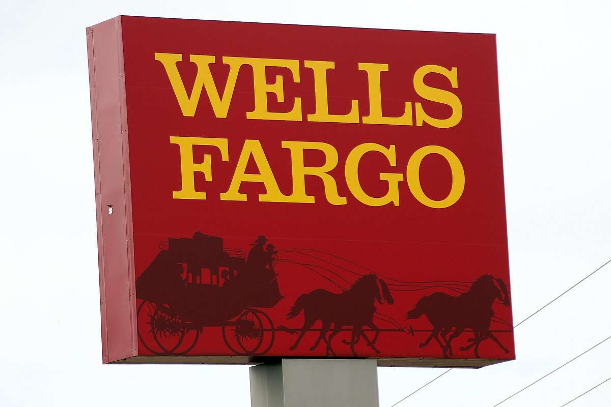 FILE - This April 11, 2017, photo shows a Wells Fargo bank in northeast Jackson, Miss. Wells Fargo agreed Wednesday, Aug. 1, 2018, to pay a $2.1 billion fine to settle allegations it misrepresented the types of mortgages it sold to investors during the housing bubble that ultimately led to the 2008 financial crisis. 