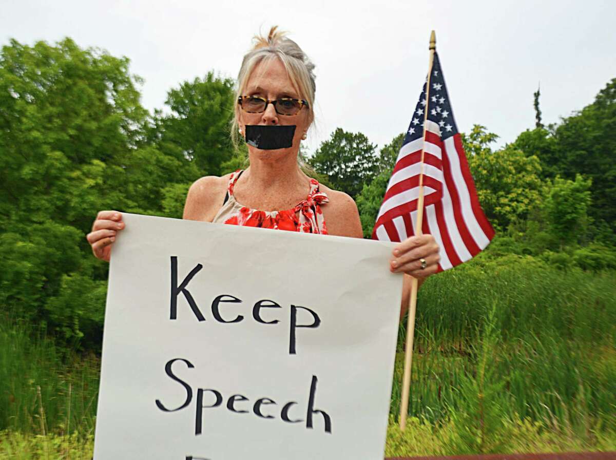 Haddam Selectwoman Melissa Schlag was condemned during the Board of Selectmen’s meeting Monday night, as person after person spoke against her taking a knee during the Pledge of Allegiance. Her supporters formed a long line along the driveway leading to the Haddam firehouse, where the meeting was held, holding signs affirming their belief in the right of free speech.
