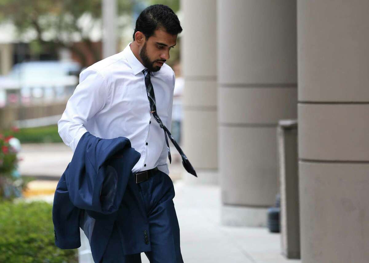 Asher Abid Khan, of Spring, walks toward the United States District Courthouse for his sentencing before a federal court judge on June 25, 2018, in Houston. Khan was a University of Houston student who admitted he plotted to join the jihadist fight in Syria. ( Yi-Chin Lee / Houston Chronicle )