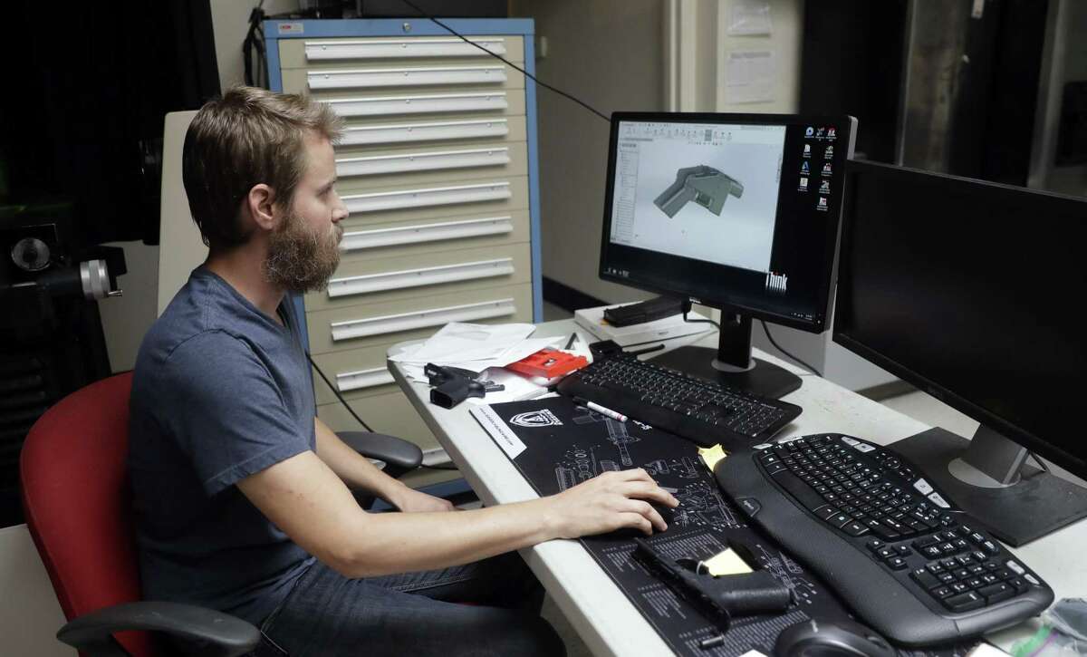 Ben Chalker shows the CAD software of a 3D-printable gun called the Liberator, Wednesday, Aug. 1, 2018, in Austin, Texas. A federal judge in Seattle issued a temporary restraining order Tuesday to stop the release of blueprints to make untraceable and undetectable 3D-printed plastic guns. (AP Photo/Eric Gay)