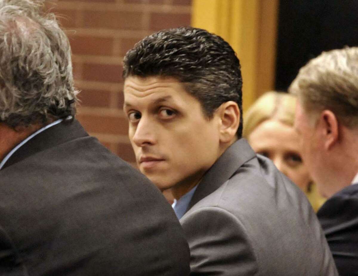 In this 2010 file photo, Marash Gojcaj sits with his attorneys in Superior Court in Danbury, during his trial the murder of Joe Vuli.