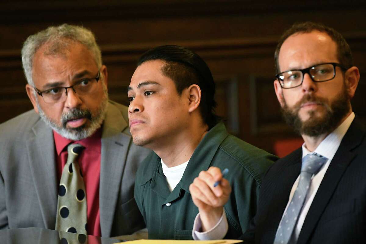 Interpreter Jorge Baldizon, left, translates for Cresencio Salazar, center, as his attorney Trevor Hannigan, right, listens to Cheryl McDermott, assistant district attorney, speak to State Supreme Court Justice Andrew Ceresia at the Rensselaer County Court House on Thursday, Aug. 2, 2018 in Troy, N.Y. Salazar was not indicted by DA Joel Abelove within 45 days as set by state law in the case of two Mexican nationals allegedly killed by Salazar and three other men, all of whom are Mexican nationals.(Lori Van Buren/Times Union)