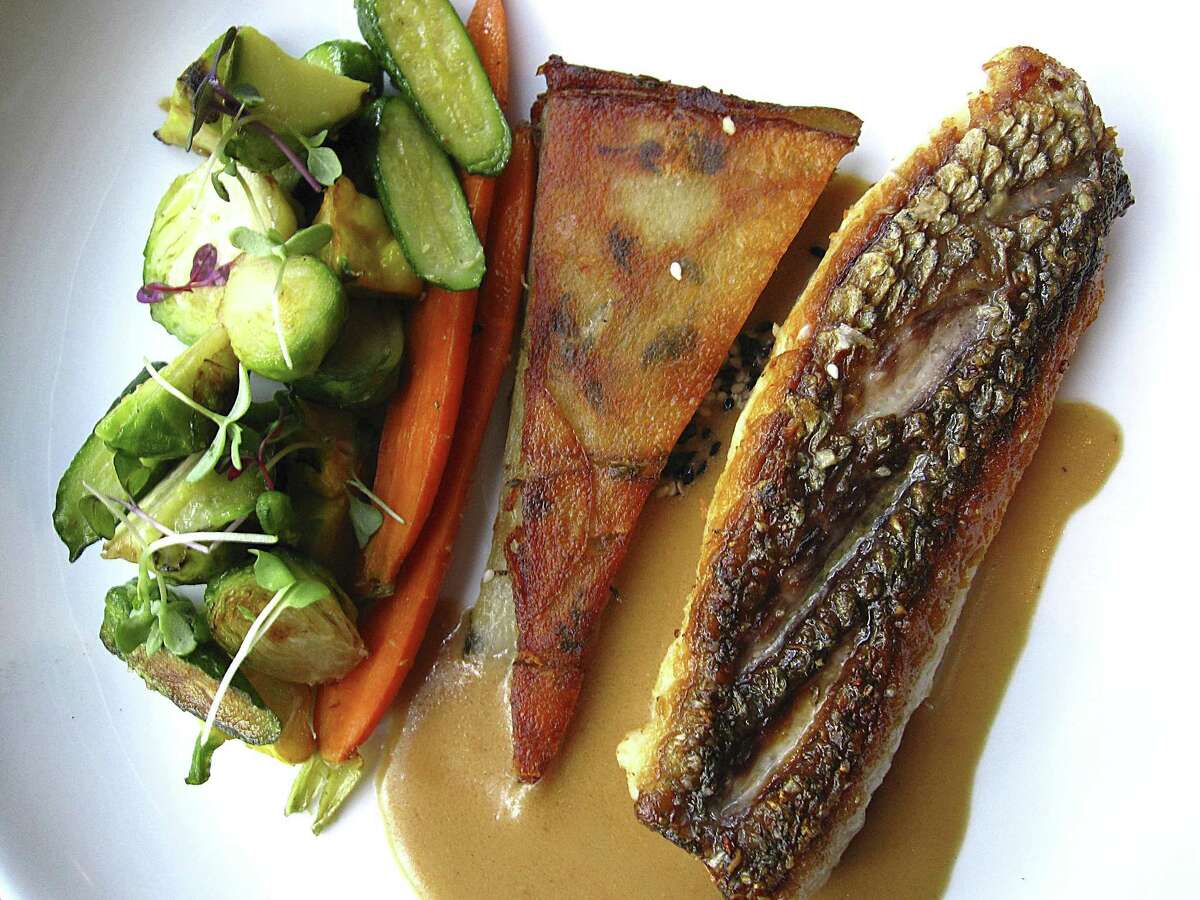 Pan-seared red snapper with ginger-soy sauce, vegetables and potato galette from Spoon Eatery.