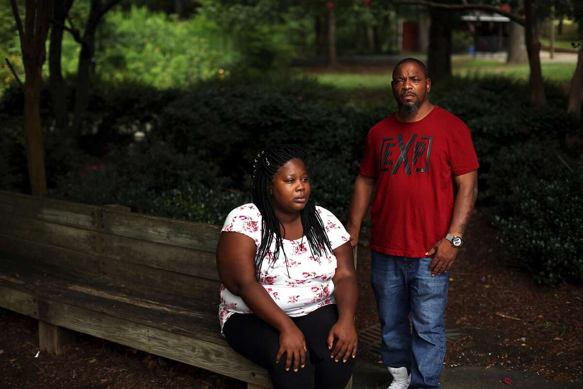 Whitney Brown, left, and Keith Sellars at Burlington City Park in Burlington, N.C., July 25, 2018. Sellars and Brown are among twelve people who voted in the 2016 election while still on felony probation or parole who are now being prosecuted in Alamance County. �I didn�t know,� Sellars said. �I thought I was practicing my right.� (Travis Dove/The New York Times)
