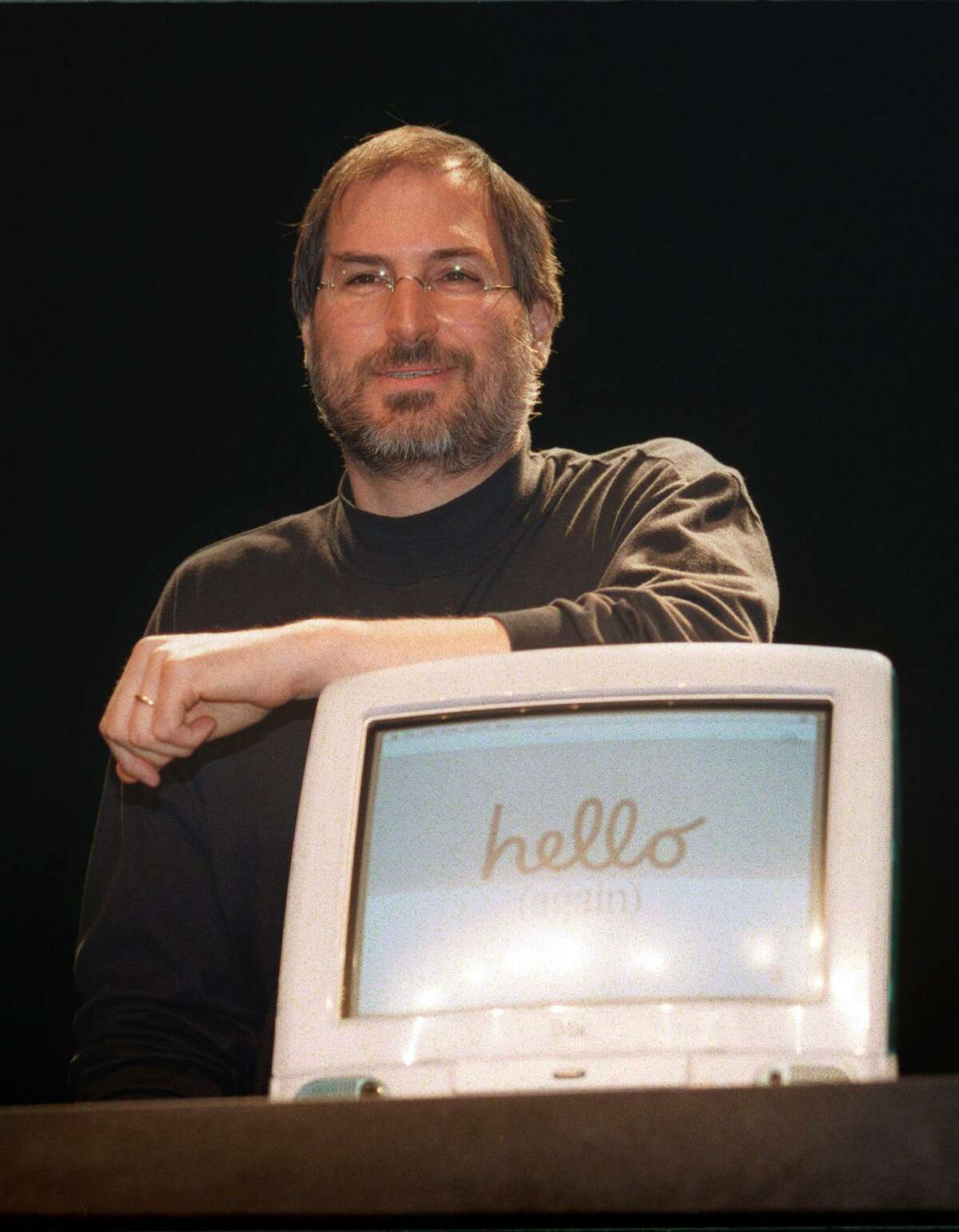 In this file photo taken on September 17, 1998, Steve Jobs, CEO of Apple, gives a press conference, part of the annual fair "Apple Expo", at the Porte de Versailles in Paris, where he came to promote the latest creation of the American computer Group, the personal computer iMac. Apple -- the culture-changing company behind the iPod, iPhone and iPad -- hit another milestone on Thursday, August 2, 2018, becoming the first private-sector company to surpass $1 trillion in market value. Shares of Apple hit $207.91 in afternoon trading on Wall Street, allowing it to hit the magic number two days after the California tech giant reported strong quarterly earnings. The landmark is the latest victory for Tim Cook, who faced skepticism when he took over as chief executive in 2011 from ailing iconic co-founder Steve Jobs.