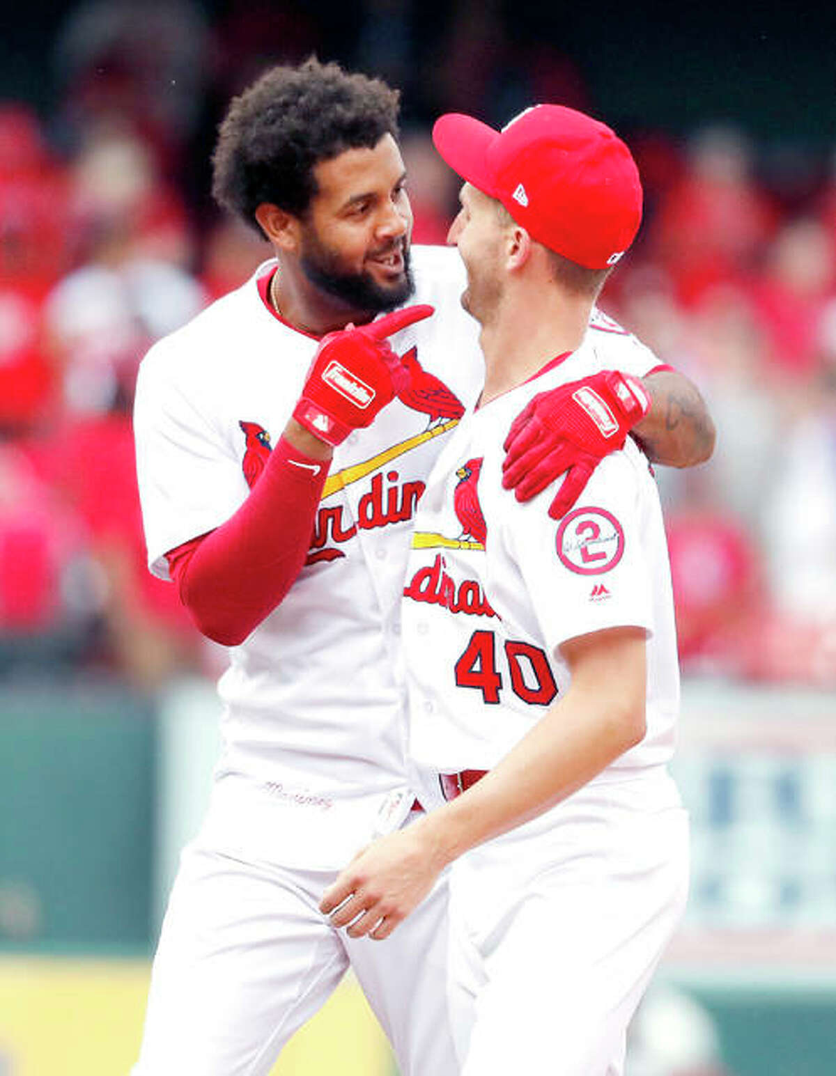 The Cardinals’ Jose Martinez, left, celebrates with teammate Chasen Shreve after hitting an RBI walkoff single to defeat the Colorado Rockies 3-2 Thursday at Busch Stadium.