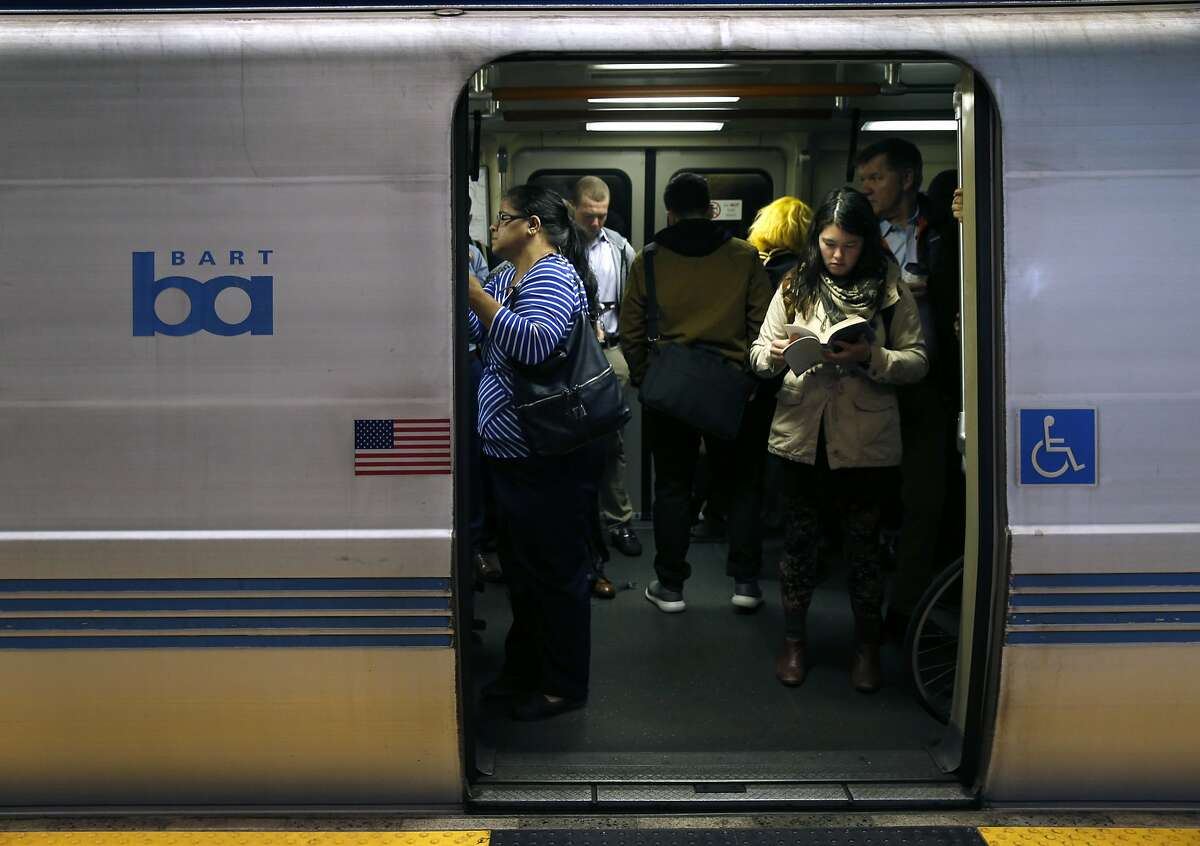 Passengers aboard a San Francisco bound train wait for the doors to close at the 19th Street BART station in Oakland, Calif. on Thursday, Aug. 2, 2018. BART is setting up a bus bridge between the West Oakland station and the 19th Street and Lake Merritt stations during selected weekends in August and September to perform critical track work.
