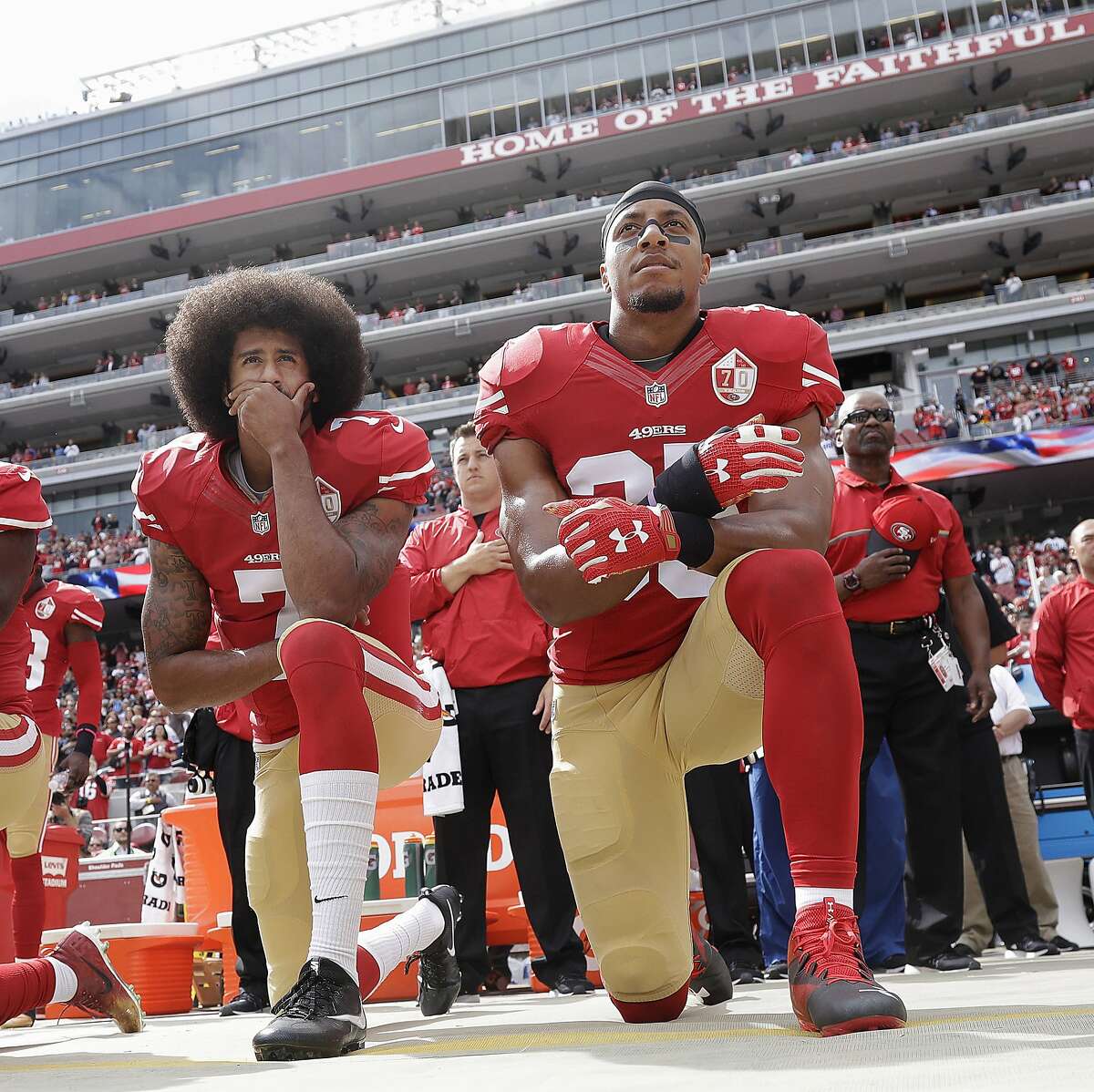 September 1 2016 - Kaepernick (L) is joined by Eric Reid (R) in kneeling for the national anthem. They opted to kneel rather than sit down (as Kaepernick had been doing) to show more respect for military. This picture was taken a month later, on Oct. 2, 2016 before an NFL football game against the Dallas Cowboys in Santa Clara, Calif.