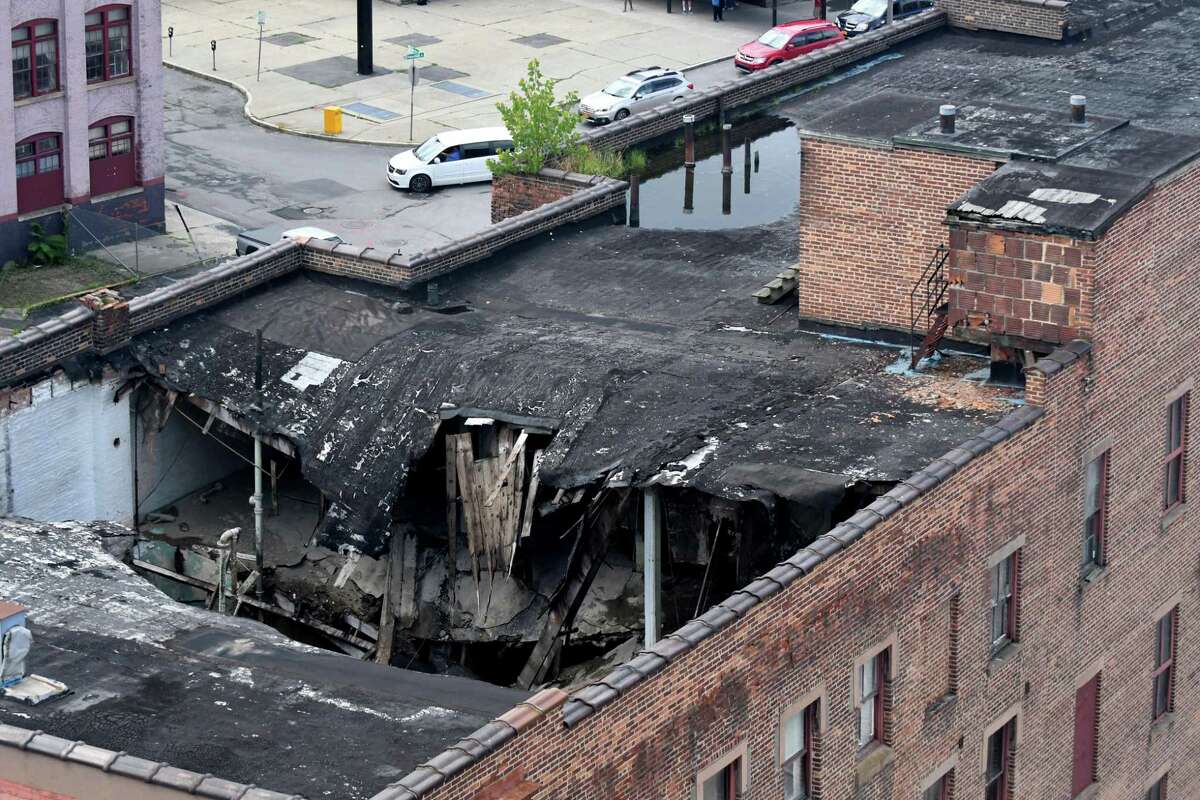 View of the collapsed roof at Six E-Comm Square on Thursday, Aug. 2, 2018, on Broadway in Albany, N.Y. The lower end of Broadway was closed due to safety concerns. (Will Waldron/Times Union)
