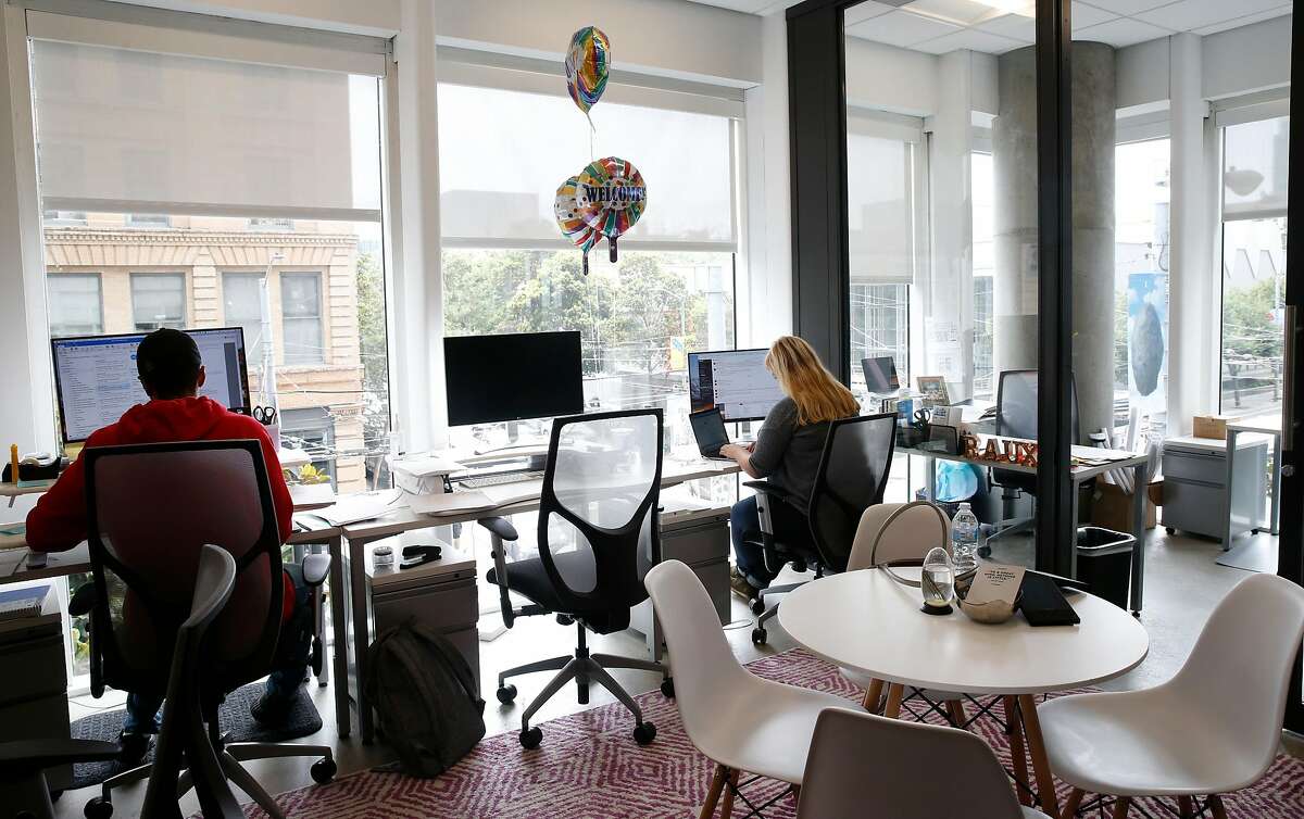 Rauxa employees work in the marketing agency�s corner suite at the Spaces shared co-working offices at Third and Mission streets in San Francisco, Calif. on Thursday, Aug. 2, 2018.