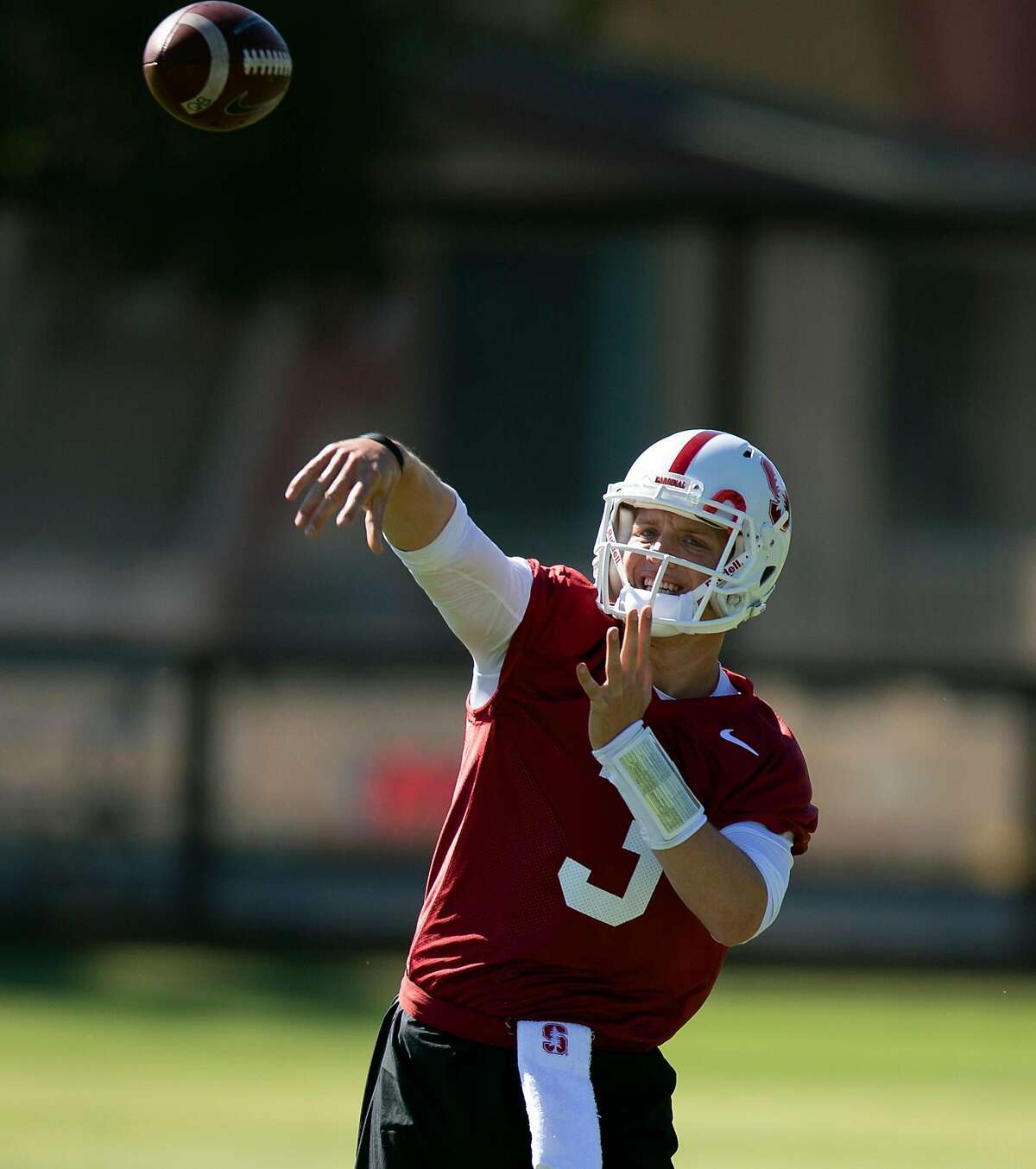 Stanford quarterback K.J. Costello (3) works out with his team on the first day of training camp, Thursday, Aug. 2, 2018 in Stanford, Calif.