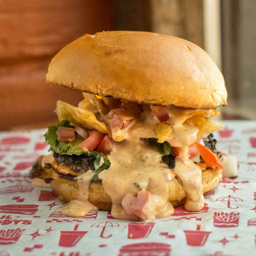 For a tall burger... The namesake Lil Woody with its diced pickles is affordable and satisfying, beckoning Seattleites near and far for savory slabs of beef nestled between toasted buns.