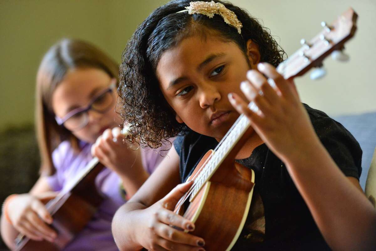 All the cool kids are now playing the ukulele. Yes, really