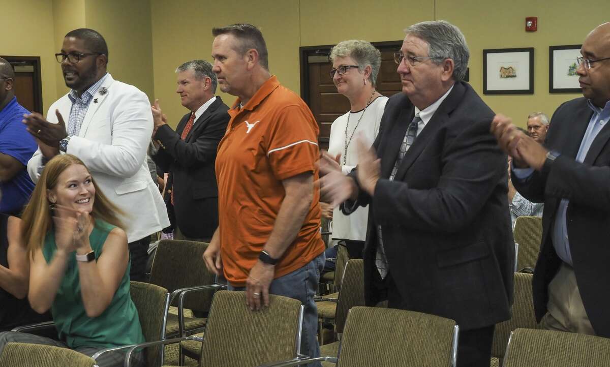 Midland ISD employees stand and applaud after Midland Commissioners Court announce a vote and approval of $5 million for schools 08/03/18 as the court gives out more than $11 million in sales tax money to area groups serving county residents. Tim Fischer/Reporter-Telegram
