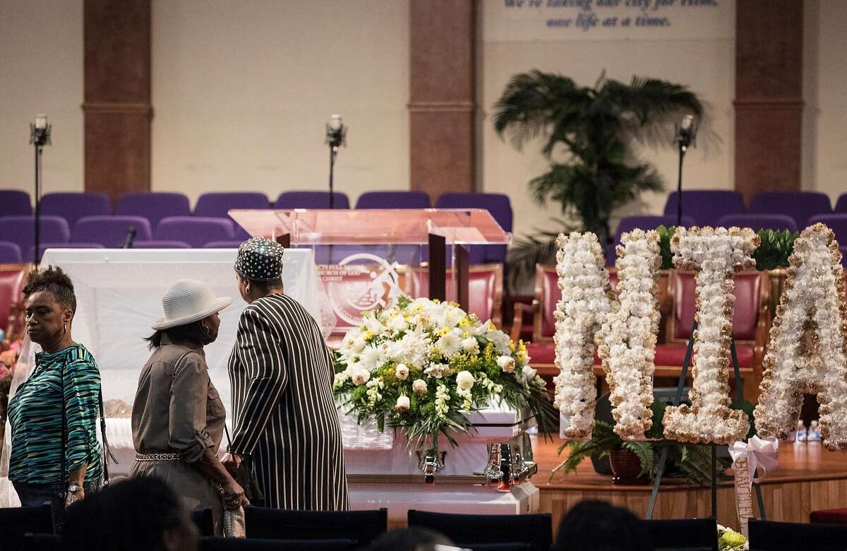 Mourners pay their respects during a funeral service held for 18-year-old Nia Wilson of Oakland at Acts Full Gospel Church in Oakland, Calif. Friday, Aug. 3, 2018. Wilson was killed Sunday, July 22, 2018 at Macarthur Bart station in Oakland, Calif.