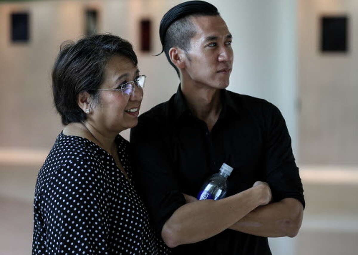 William Nguyen, right, stands with his mother Vicky Nguyen after arriving at Bush IAH, Friday, Aug. 3, 2018, in Houston. William Nguyen was held in a Vietnamese jail for 40 days, after being arrested during a protest in Ho Chi Minh City.