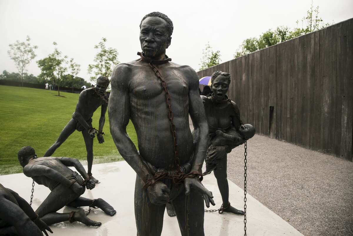 A sculpture depicting the slave trade greets visitors at the entrance to the National Memorial For Peace And Justice on April 26, 2018 in Montgomery, Ala.