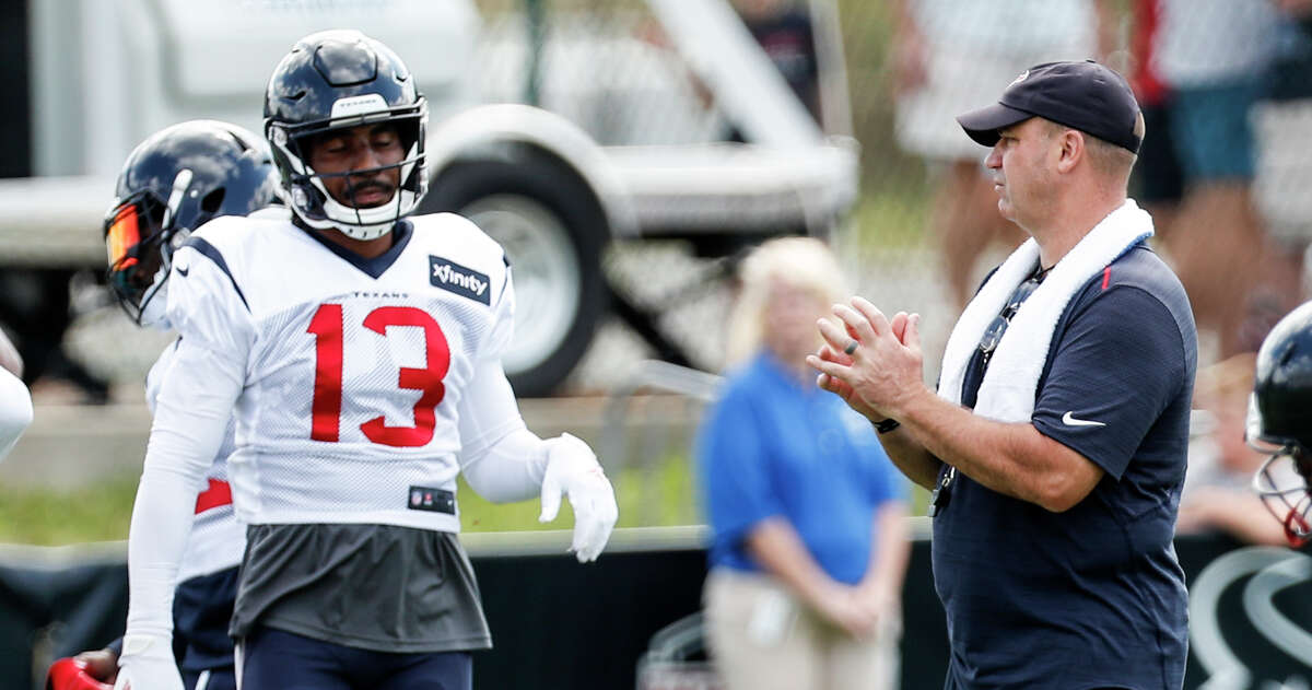 Houston Texans head coach Bill O'Brien works with wide receiver Braxton Miller (13) during training camp at the Greenbrier Sports Performance Center on Saturday, July 28, 2018, in White Sulphur Springs, W.Va.