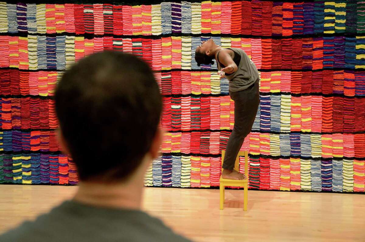 Candace Rattliff Tompkins, right, works with Jane Weiner as they rehearse choreography for an upcoming site-specific performance around “Crêpe Paper Carpet,” a sculptural installation at Moody Center for the Arts.