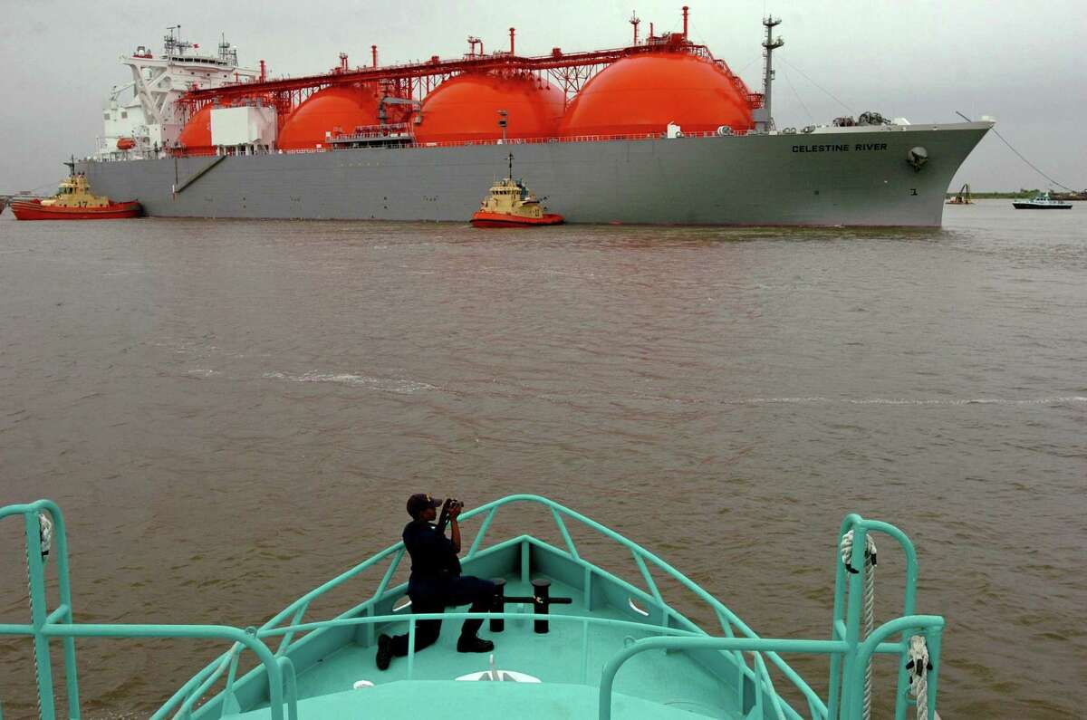 U.S. Coast Guard Lt. j.g. Niya J. Williams takes photos from the deck of the Sabine Pilot II as boats maneuver the Celestine River LNG vessel into position during the first arrival of liquified natural gas at the Sabine Pass LNG on April 11, 2008. The 145,000 cm-capacity vessel transported the cargo from Nigeria to the facility owned by Cheniere Energy Inc. China’s proposal of 25 percent tariff on imports of U.S. liquefied natural gas could impede U.S. access to one of the world’s largest LNG markets during a time of intense competition for global export dominance.