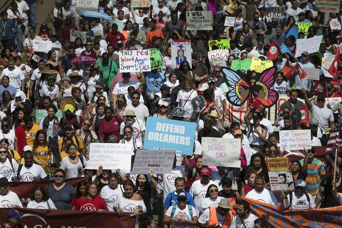 FILE — Protesters march towards the Immigration and Customs Enforcement agency headquarters in Washington, Sept. 5, 2017. A federal judge upheld his previous order to revive the Obama-era program that shields some 700,000 young immigrants from deportation, saying on Aug. 3, 2018 that the Trump administration had failed to justify eliminating it. (Tom Brenner/The New York Times)