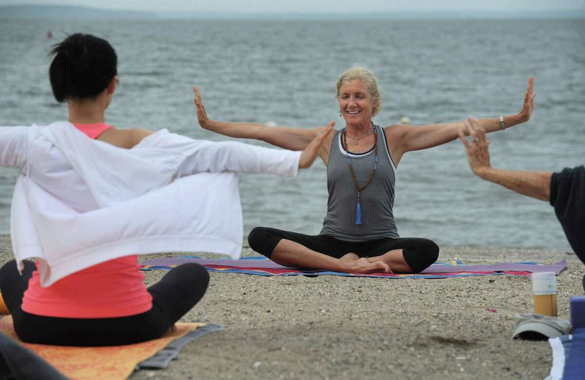 Martha Risom teaches Community Yoga at Bayley Beach, in their 6th season, Saturday, August 4, 2018, in Rowayton, Conn. The classes, sponsored by the Sixth Taxing District, begin Memorial Day Weekend each year and run through September 30. Weekend classes start at 8am. Thursday classes start at 9:15am.