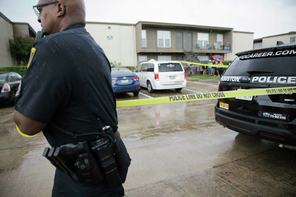 Houston Police Dept. put out a police tape in the apartment complex where two young children's bodies were found in their father's apartment on Saturday, Aug. 4, 2018 in Houston. Jean Pierre Ndossoka was charged with capital murder in the deaths. Photo: Elizabeth Conley, Houston Chronicle / © 2018 Houston Chronicle