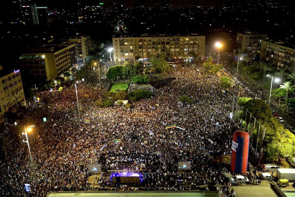 Israelis from the Druze community participate in a rally against Israel's Jewish Nation Bill in Tel Aviv-Yafo, Saturday, Aug. 4, 2018. Thousands of members of Israel's Druze minority and their Jewish supporters packed a central Tel Aviv square Saturday night to rally against a contentious new law that critics say sidelines Israel's non-Jewish citizens. (AP Photo/Sebastian Scheiner)