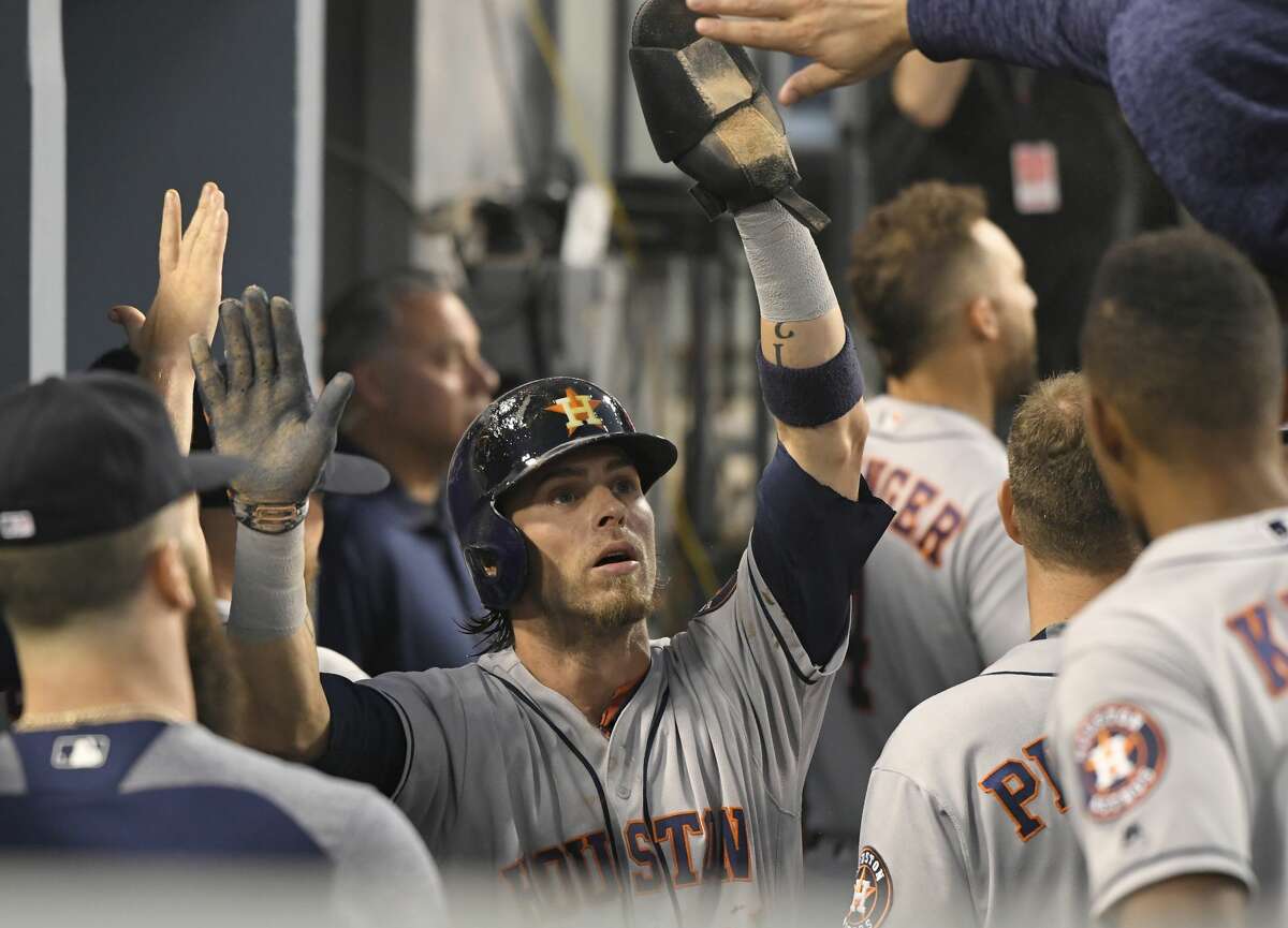 Houston Astros' Josh Reddick gestures after hitting a double