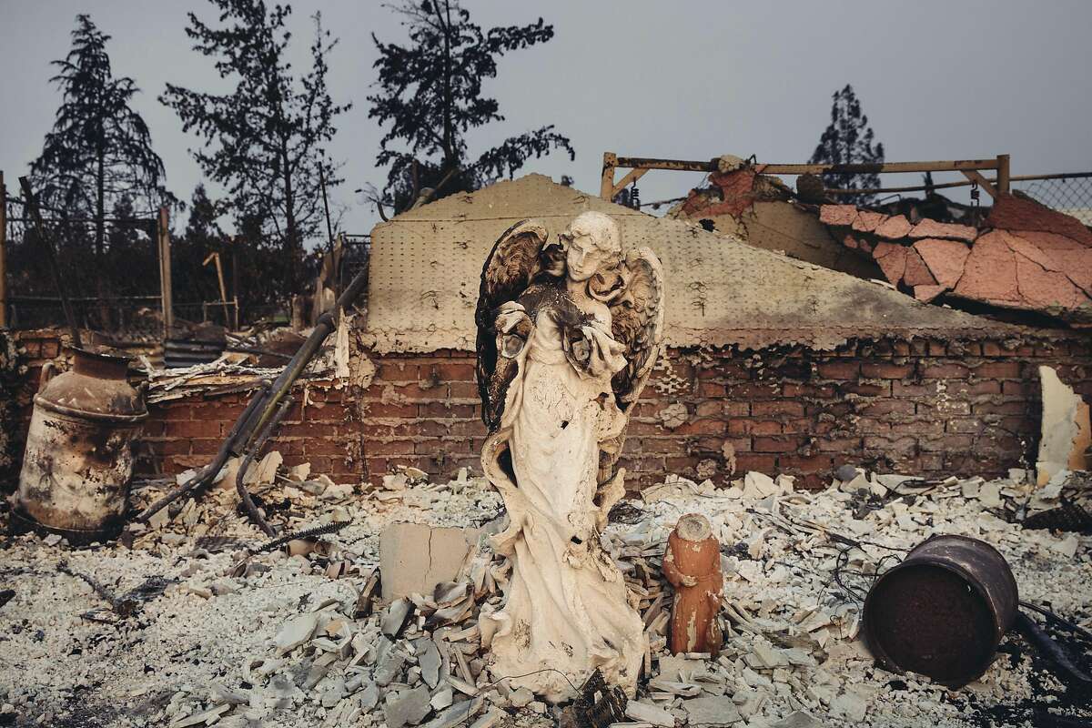 An angel statue stands in the rubble of Catalina Way, a street in the Lake Keswick Estates area, which was devastated by the Carr fire, in Redding, Calif., Aug. 3, 2018. The fire took a particularly nightmarish turn when what locals are calling a fire tornado tore through neighborhoods in the town of Redding, which has a population of more than 90,000. (Niko Koppel/The New York Times)