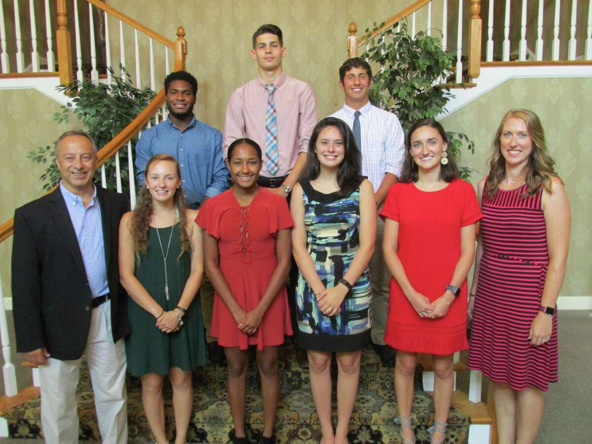 This year’s Varsity Alumni Club scholarship winners and officers are, front row, left to right: President Mario Longobucco, Cara Baker, Ariana Santos, Catherine Butrick, Anna Clinkscales, Vice President Christine Gamari. Second row, left to right: Dylan Myrie, Billy Cook, Billy Weber. Scholarship winner Cassie Fedor was unable to attend.