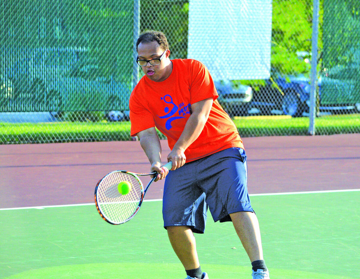 Kamali Mitchell makes a shot during the seventh annual Mitch n’ Friends night at the EHS Tennis Center.