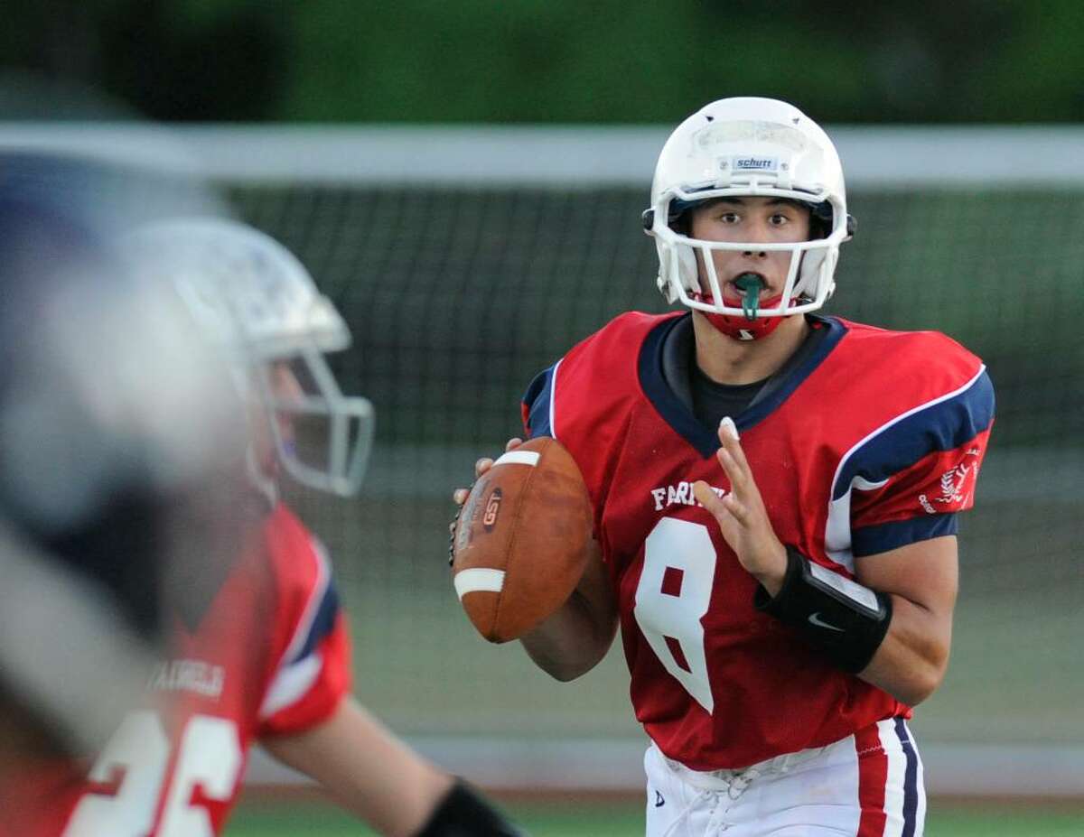Mike Lefflbine, quarterback for the Fairfield County all-stars looks for an oprn receiver during the New Haven County vs. Fairfield County all-star high school football game Ken Strong Stadium, West Haven High School, Friday evening, July 9, 2010.