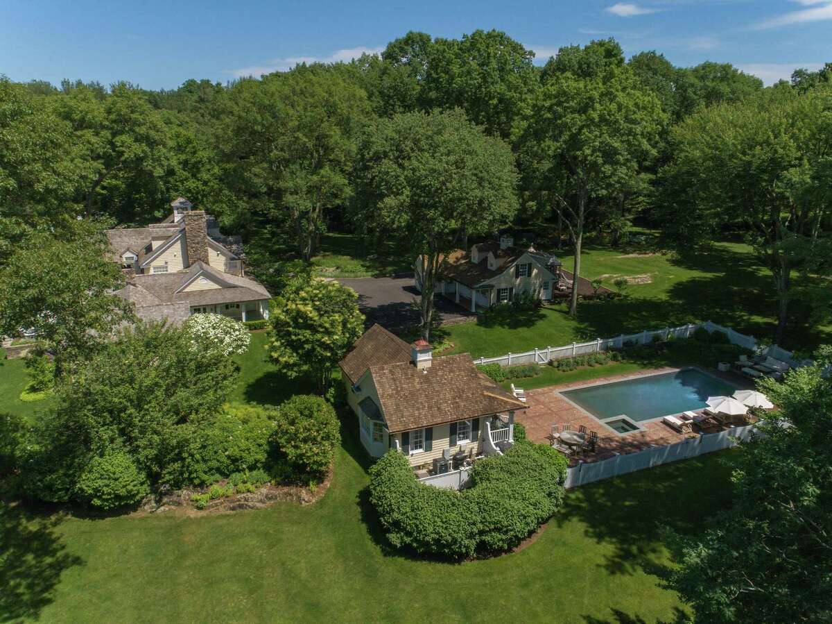 The 7,000-square-foot center hall colonial at 20 Partridge Hollow is located in a private, gated community with 24-hour security. Its 5.79-acre lot sits adjacent to the 285-acre Audubon property, rendering it particularly private. The "quintessential country compound" is listed for $5.85 million.