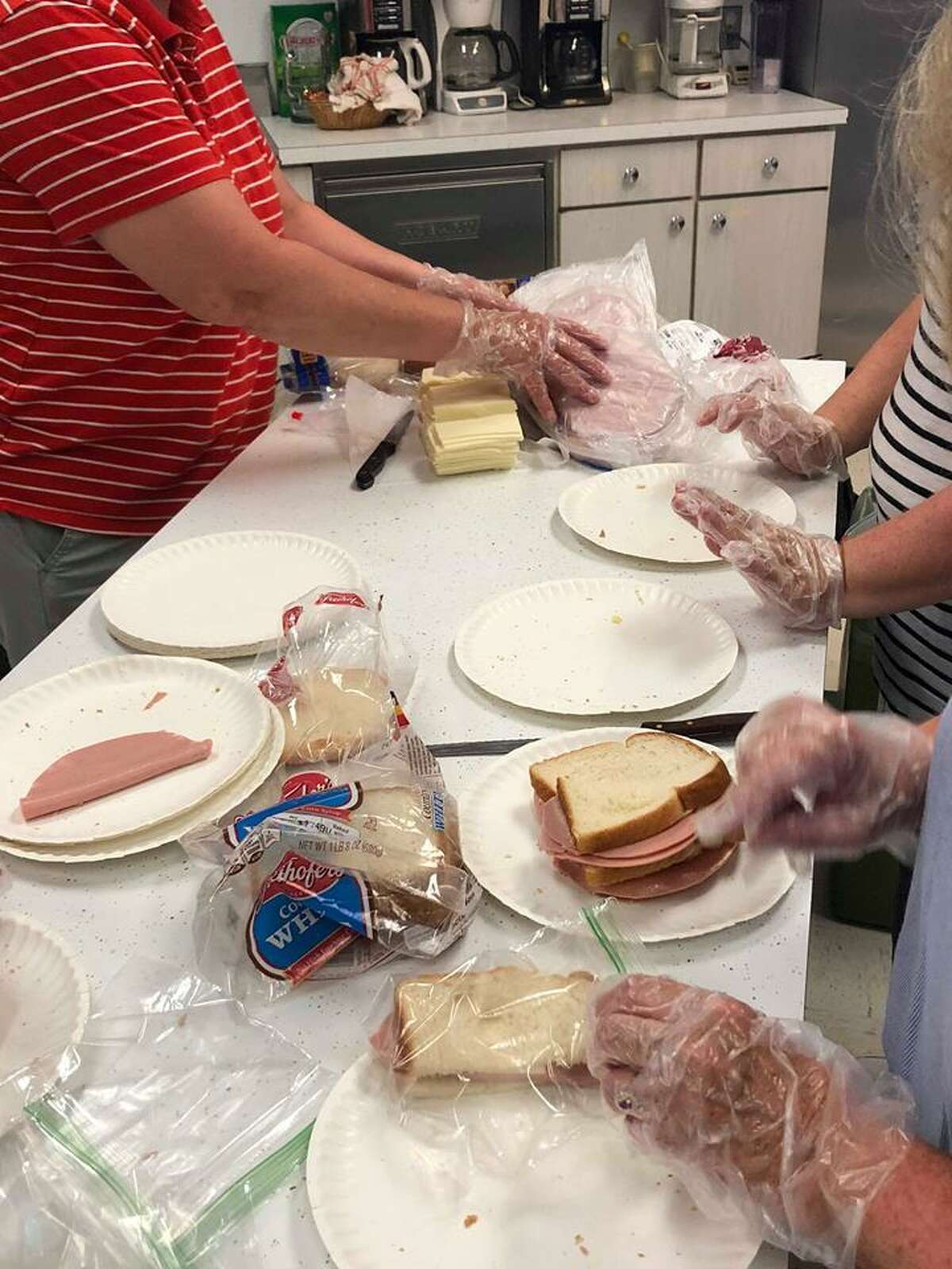 Photo from Camella’s Cupboard preparing sandwiches for the summer lunch program.