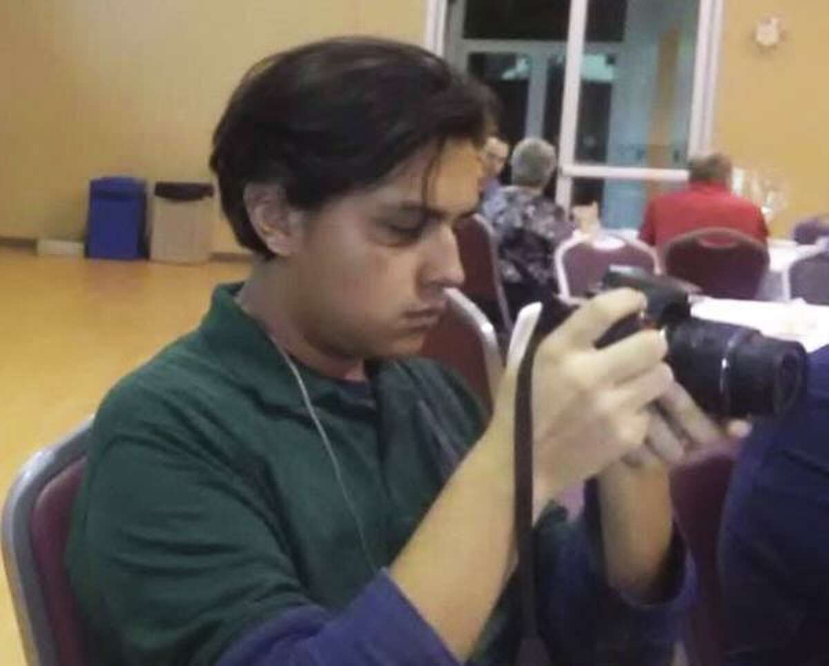 Sergio Salazar, 18, checks out his camera in this undated photo. Salazar, a student activist known as "Mapache," was arrested Friday, Aug. 3, 2018, in San Antonio by federal agents on an alleged immigration violation after his request for DACA status renewal was denied. He and his supporters say he was targeted in retaliation for calling for the elimination of ICE and protesting the Trump Administration's immigration policy. ICE officials deny that claim.