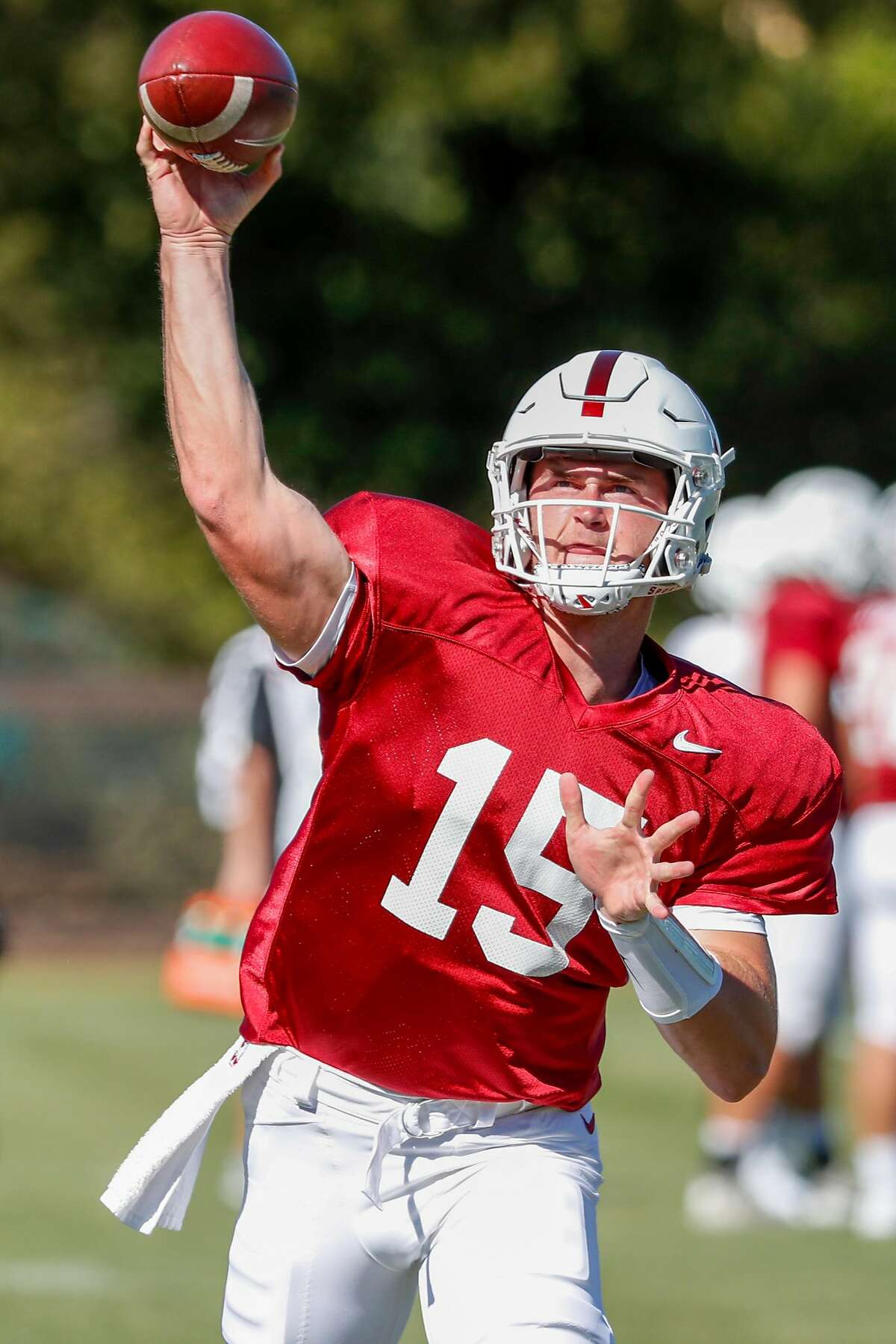 Stanford quarterback Davis Mills (15) throws a ball while doing drills during Stanford football practice at Stanford, Calif., on Monday, August 6, 2018.