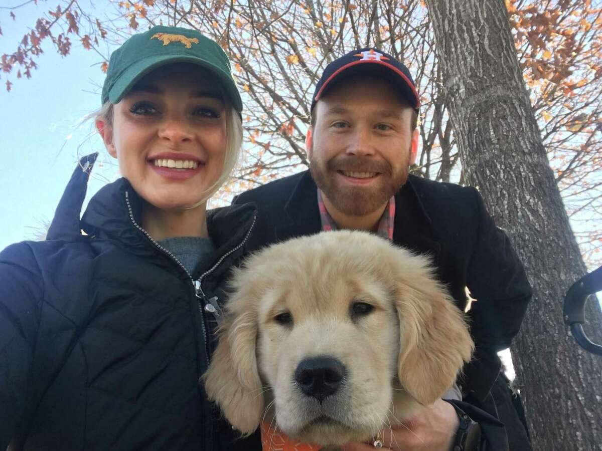Sarahbeth and Pierce Bush with their growing young golden retriever, Winston Moose, an Instagram star with more than 52,000 followers.