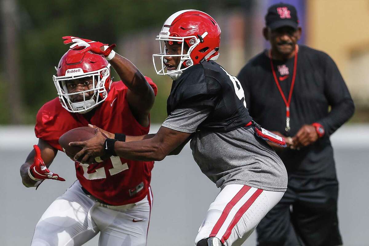 Quarterback D'Eriq King (right) and running back Patrick Carr are part of a UH offense that should be more up-tempo this season with new coordinator Kendal Briles at the helm.
