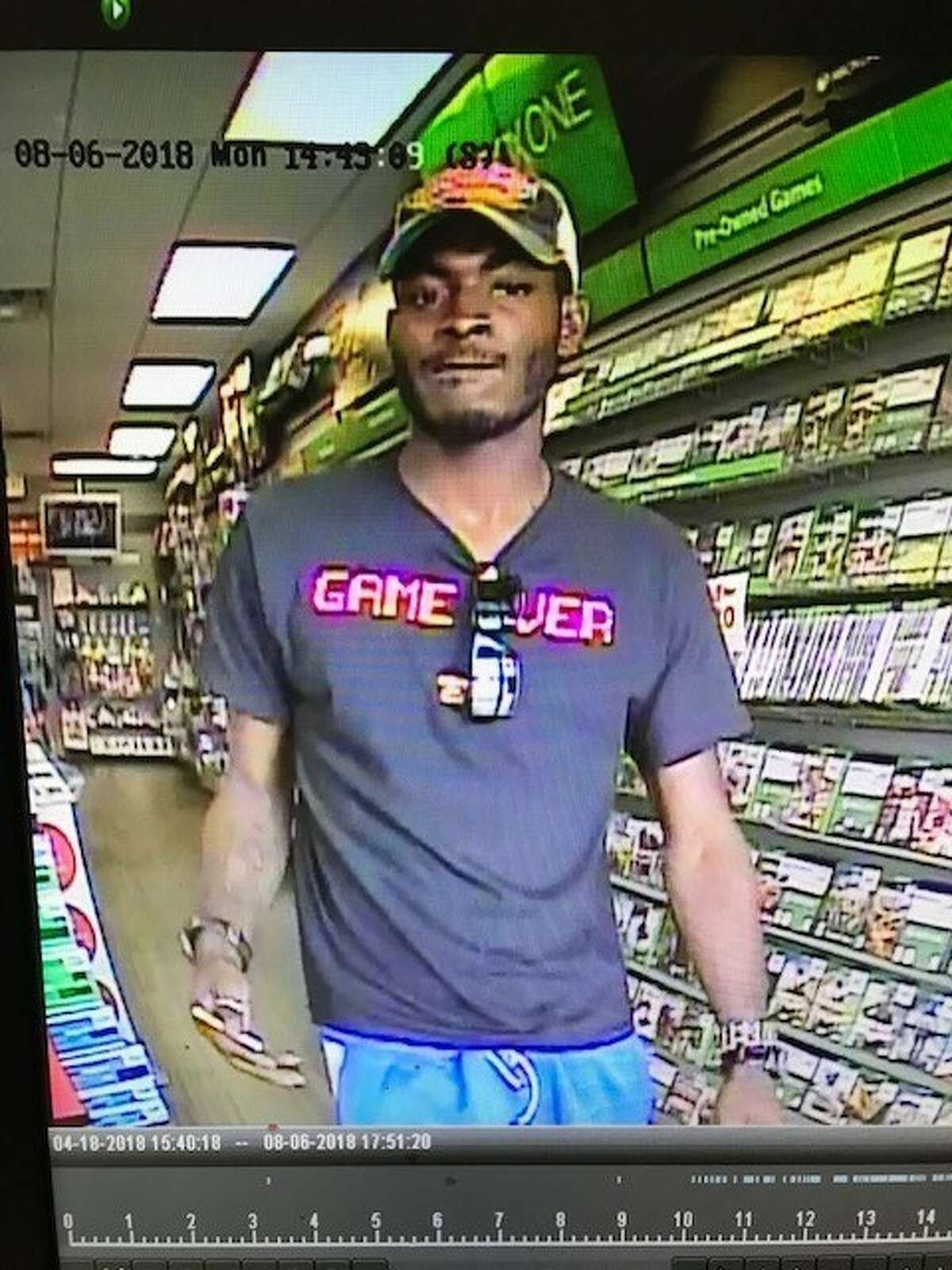 The suspect pictured was caught on surveillance camera, allegedly attempting to make a video game console purchase with a credit card stolen during an Aug. 6, 2018 vehicle burglary in Friendswood.
