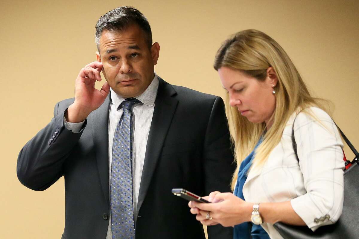 David James Gomez stands with defense attorney Jacqueline Kriebel during a morning recess in his murder trial in Felony Impact Court, presided by Dick Alcala, in the Bexar County Courthouse on Wednesday, Aug. 8, 2018. Gomez is accused of killing his business partner, Isaias Flores, after the two argued at the car shop they owned in the 900 block of Bitters Road on April 7, 2015. Gomez has claimed self-defense.