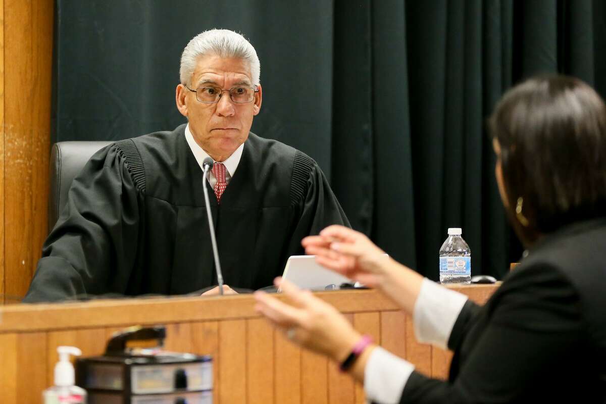 Judge Dick Alcala listens to a comment by prosecutor Stephanie Franco during an Aug. 8 recess in Felony Impact Court in the Bexar County Courthouse.