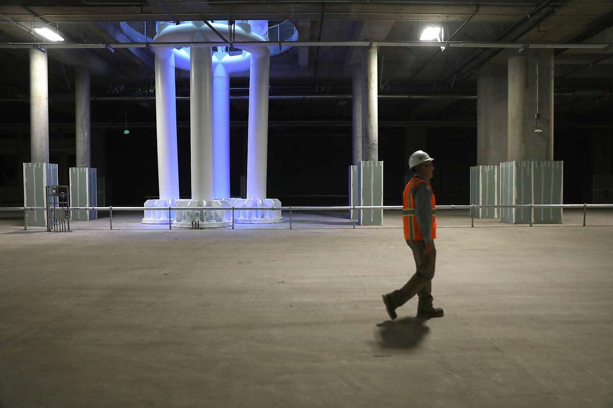 Designer engineer Skip Sowko shows the train box, a cavernous basement of the new Salesforce Transit Center, where trains will one day pull in seen on Wednesday, Aug. 8, 2018 in San Francisco, Calif.