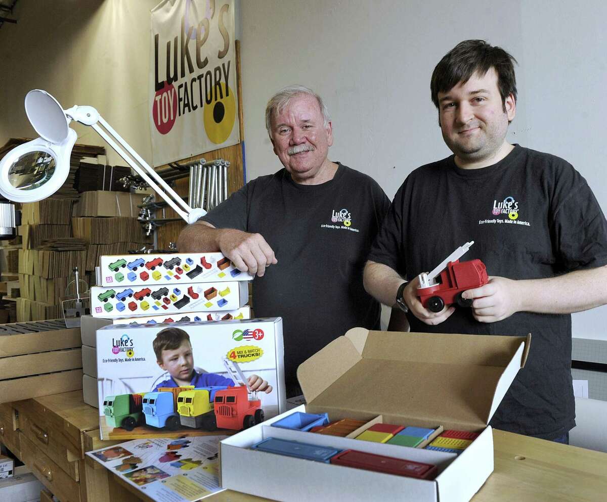 James Barber and son Luke of Luke's Toy Factory in Danbury, Tuesday, August 7, 2018. The packaging is made specifically for their European market.