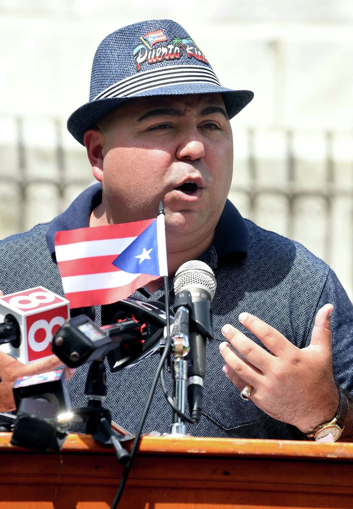 FILE - Joe Rodriguez, president of Puerto Ricans United-Puerto Rican Festival of New Haven, speaks before the Puerto Rican flag is raised on the New Haven Green on August 9, 2018 in honor of the Third Annual New Haven Puerto Rican Festival. 